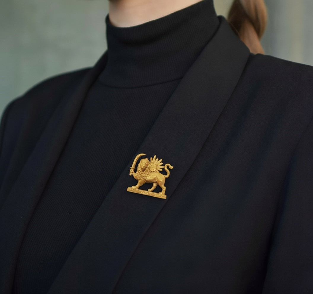 Gold 3D printed Lion and Sun brooch pinned on a black suit lapel, representing the historical Shir o Khorshid symbol of Iran