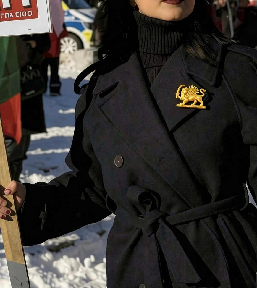 Gold 3D printed Lion and Sun brooch pinned on a black suit lapel, representing the historical Shir o Khorshid symbol of Iran